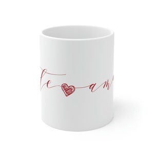 May include: White ceramic mug with a red heart and the text "Je t'aime" in cursive.