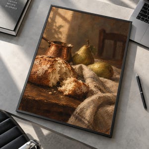 May include: A framed rectangular wall art print featuring a still life painting of a crusty loaf of bread, two green pears, and a copper pot resting on a wooden surface draped with a textured beige cloth, all rendered in warm, earthy tones.