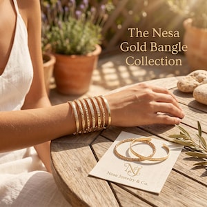 May include: A collection of gold bangles featuring various textures and patterns, including smooth, twisted, and etched designs. The text The Nesa Gold Bangle Collection is visible, along with a card labeled Nesa Jewelry & Co. displaying two bangles.