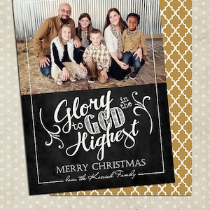 May include: Christmas card with a family photo and a chalkboard design. The text says "Glory to God in the Highest, Merry Christmas." The card has a gold and white patterned border and the words "to such as these DESIGNS".