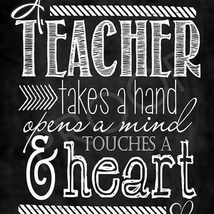 May include: A black and white chalkboard with the text "A Teacher takes a hand opens a mind & touches a heart" written in a stylized font. The text is surrounded by a white striped border.