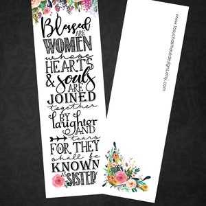 May include: A bookmark with a floral design and the text "Blessed are women whose hearts & souls are joined together by laughter and tears for they shall be known as sister". The bookmark is 2 inches by 7 inches and is press-printed on linen paper.