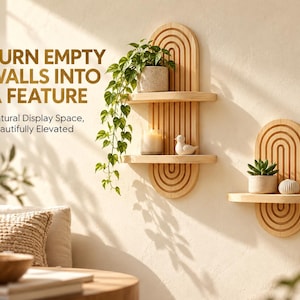 May include: Two light wood wall shelves with arched backings featuring vertical grooved lines. The taller shelf has two tiers holding a potted trailing plant, a candle, and a bird figurine. The shorter shelf holds a succulent and a small sphere.