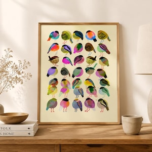 May include: A rectangular wall art print featuring a grid of thirty stylized birds in various vibrant colors including pink, blue, green, yellow, and orange. Each bird is depicted in a simple, rounded shape against a light cream background.