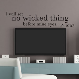 May include: A living room interior with a light blue sofa, a flat screen TV, and a white shelf with a potted plant. The wall behind the TV has a black vinyl decal with the text "I will set no wicked thing before mine eyes. Ps 101:3"