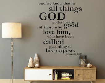 May include: A wall decal with a bible verse from Romans 8:28, "And we know that in all things God works for the good of those who love him, who have been called according to his purpose." The decal is printed in black on a gray wall.