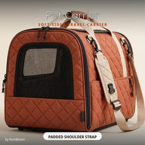 May include: A rust-colored, quilted soft-sided pet carrier featuring black mesh windows, dual top handles, and a detachable padded shoulder strap. The text Pet Carrier, SOFT-SIDED TRAVEL CARRIER, and PADDED SHOULDER STRAP are visible.