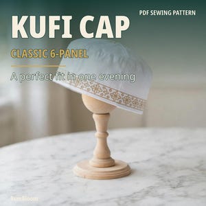 May include: A white 6-panel kufi cap featuring a gold-colored geometric floral border pattern along the bottom edge. The text KUFI CAP, CLASSIC 6-PANEL, and A perfect fit in one evening are visible on the image.