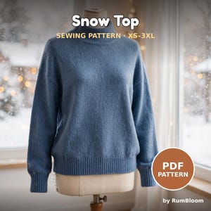 May include: A blue long-sleeve sweater with a mock neck and ribbed cuffs and hem. The text on the image reads Snow Top SEWING PATTERN XS-3XL and PDF PATTERN by RumBloom. The sweater is displayed on a dress form.