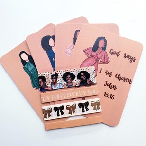 May include: A set of peach-colored cards with illustrations of women in various outfits. The cards are accompanied by decorative tape featuring bows and the words "LY hello LOVELY hello". One card has the text "God says I Am Chosen John 15:16".