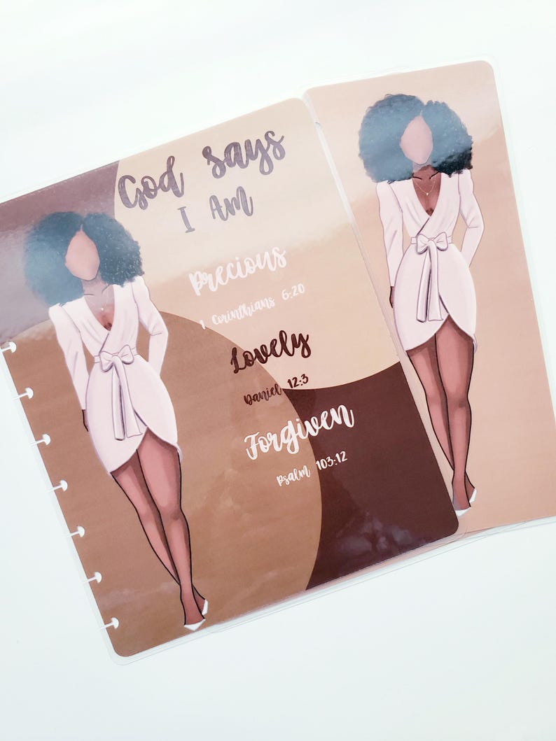 May include: Two planner inserts with illustrations of a woman in a white dress. The text "God says I Am Precious, Lovely, Forgiven" is written on one insert. The inserts have a light brown and white color scheme.