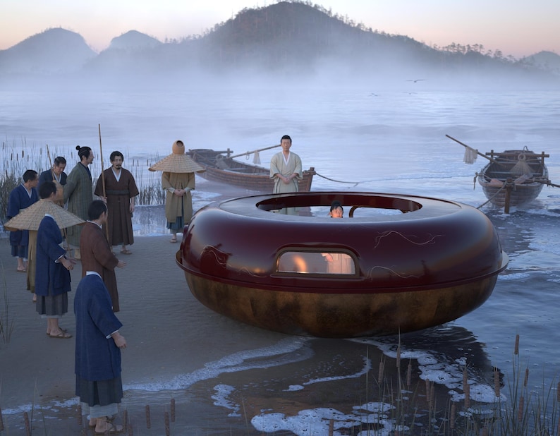 May include: A large, circular, dark red vessel with a glossy finish and a central opening, resting on a sandy shore. The vessel features a small, rectangular window on its side. Several individuals in traditional clothing stand nearby on the beach.