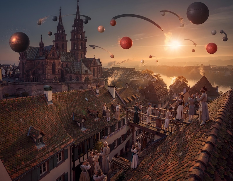 May include: A surreal cityscape featuring a large gothic cathedral with twin spires overlooking a town with tiled roofs at sunset. Numerous floating spherical objects and curved metallic structures drift through the sky above the buildings.