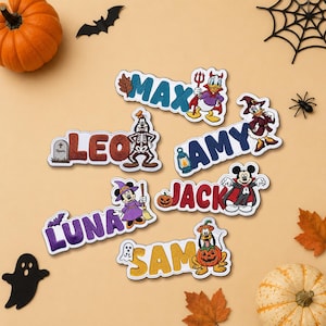 May include: Six embroidered patches featuring Disney characters in Halloween costumes with names Max, Leo, Amy, Jack, Luna, and Sam. Each patch displays a unique character like Mickey, Minnie, Donald, Goofy, Pluto, and Daisy with seasonal icons.