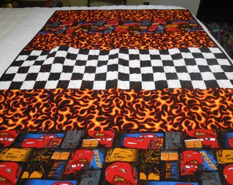 39" X 60" Cars quilt with black and white squares and flames