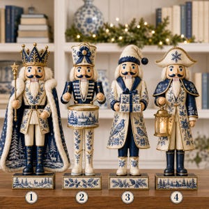 May include: Four decorative nutcracker figurines in a blue and white color scheme. The first wears a crown and cape, the second plays a drum, the third holds gift boxes, and the fourth carries a lantern. Each stands on a rectangular base.