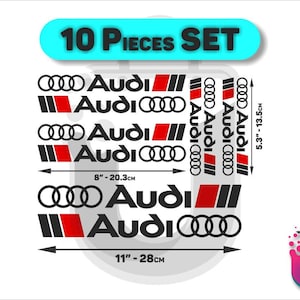 May include: A 10-piece set of Audi decals featuring the brand logo and text in black, red, and white. The set includes various sizes with dimensions clearly marked as 8 inches by 20.3 cm, 11 inches by 28 cm, and 5.3 inches by 13.5 cm for application.