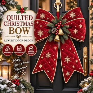 May include: A large, quilted red velvet Christmas bow featuring gold embroidered snowflakes, hanging on a black door. The center is decorated with green pine needles, red berries, a small pinecone, and two hanging gold-colored metal bells.