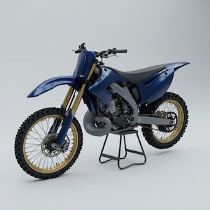 May include: A blue motocross motorcycle featuring gold-coloured rims, a black seat, and a grey frame. The bike is equipped with knobby tyres, a front disc brake, and a prominent exhaust pipe, all supported by a black metal stand on a plain background.