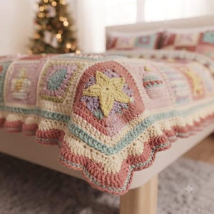 May include: A crochet blanket featuring a patchwork of squares in soft pastel pink, cream, and sage green. The design includes textured motifs such as a prominent yellow star, decorative baubles, and a scalloped cream-colored border edge.
