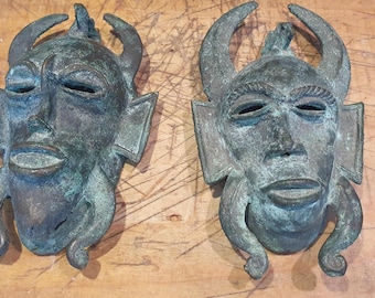 Pair of African Senufo bronze masks, 16x10