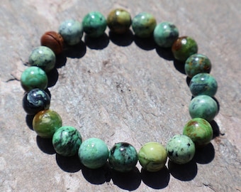 PULSERA DE VARISCITA, hermosos tonos verdes profundos, cuentas redondas de 10 mm, detalles naturales, en cordón elástico