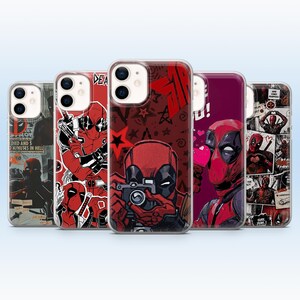 May include: Five smartphone cases featuring various graphic illustrations of the character Deadpool in red and black. The designs include comic book panels, stars, and the character holding a camera or weapons, with text elements like DEADPOOL.