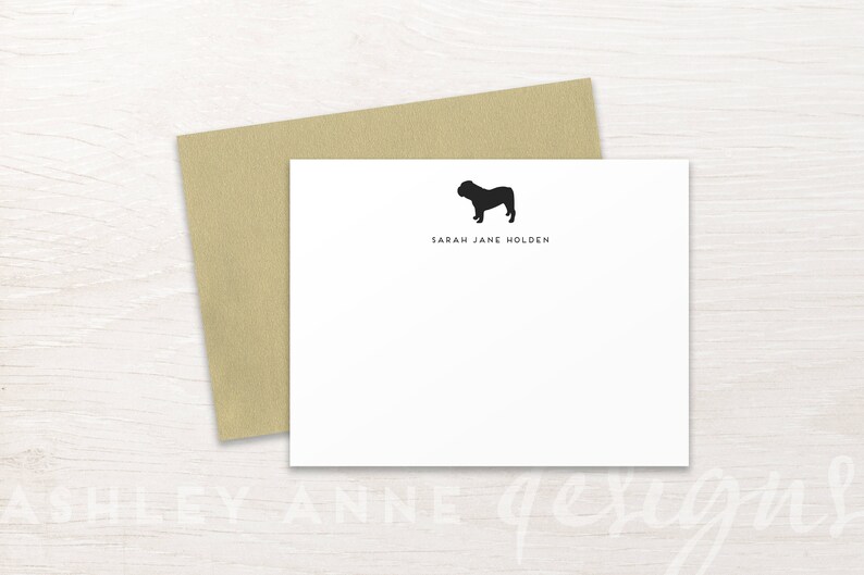 May include: A white card with a black silhouette of a bulldog and the text "Sarah Jane Holden" printed on it.