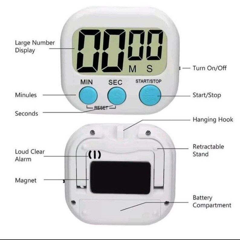 May include: A white digital kitchen timer with a large number display, three blue buttons labeled MIN, SEC, and START/STOP, a hanging hook, a retractable stand, a magnet, and a battery compartment, featuring text labels for all functional components.
