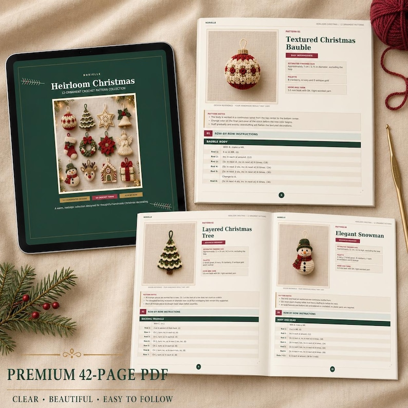 May include: A digital tablet displaying a green cover for a crochet pattern collection titled Heirloom Christmas, alongside an open printed booklet showing instructions for a Textured Christmas Bauble, a Layered Christmas Tree, and an Elegant Snowman.
