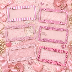 May include: Six rectangular license plate frames in various pink patterns including white stripes, white polka dots, pink glitter, and pink leopard print. Each frame features four mounting holes and a rectangular center opening for a standard license plate.