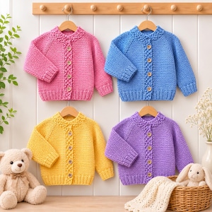 May include: Four long-sleeved knit cardigans in pink, blue, yellow, and purple, each featuring a round neckline, ribbed cuffs and hem, and a vertical row of four wooden buttons down the center front, displayed on wooden hangers.