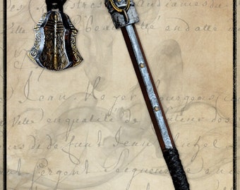 May include: A silver and black metal weapon with a chain and a decorative head. The weapon is called "Mitryl" and is on a background of old paper with writing.