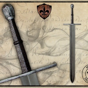 May include: A silver sword with a black leather grip and a rounded pommel. The sword is displayed against a background of old paper with writing. The image includes the text "LATEX" and "HANDMADE FAIT A LA MAIN".