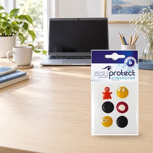 Könnte beinhalten: Eine Packung Spy Protect Cyberstop Webcam-Abdeckungen mit sechs kleinen Aufklebern. Die Motive umfassen einen roten Oktopus, ein gelbes Smiley-Gesicht, einen schwarzen Kreis, einen rot-weißen Kreis, ein gelbes Auge und einen schwarzen Kreis.