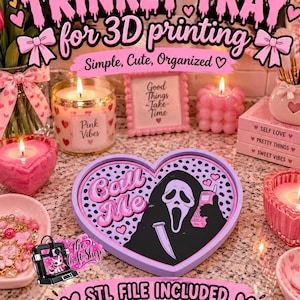 May include: A heart-shaped lavender trinket tray featuring a graphic of a masked figure holding a phone with the text Call Me. The tray has a black and white spotted background with pink hearts. The design includes STL and 3MF file included text.