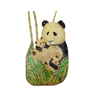 May include: A hand-carved wooden sculpture of a panda bear family. The mother panda is holding two cubs in her arms. The sculpture is painted in shades of black, white, and green, and features a bamboo background.