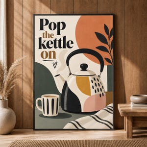 May include: A framed wall art print featuring a tea kettle and a striped mug. The text reads Pop the kettle on with a small heart symbol. The design uses a palette of cream, black, terracotta, mustard yellow, and soft pink with abstract shapes.