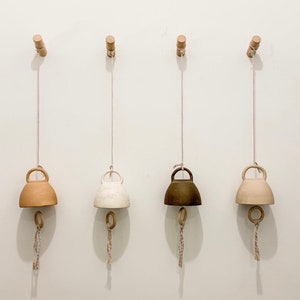 handmade ceramic bells in 12 neutral colors and 3 sizes handcrafted bells for home decor pottery chimes indoor bell outdoor bell wall art