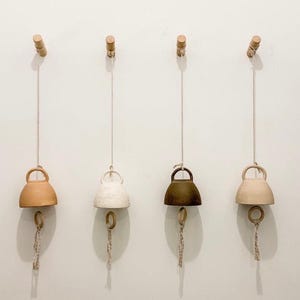 handmade ceramic bells in 12 neutral colors and 3 sizes handcrafted bells for home decor pottery chimes indoor bell outdoor bell wall art