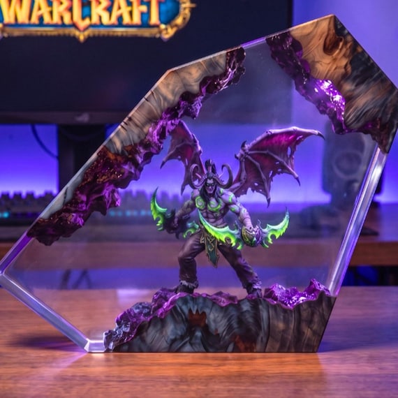 A handcrafted resin-and-wood diorama night light that doubles as a Sylvanas/WoW-inspired fantasy statue lamp — the kind of desk piece that stops guests mid-sentence.