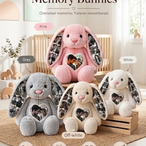 May include: Four plush stuffed bunnies in pink, grey, off-white, and white. Each bunny features a heart-shaped photo collage on its chest and additional photo collages on its long ears. The text reads Personalized Memory Bunnies, Cherished moments. Forever remembered., Custom Photo Collage, Perfect Gift, Made with Love, and Premium Quality.