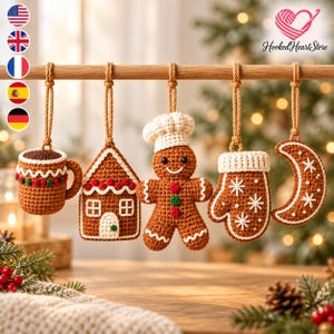 May include: Five crocheted Christmas ornaments hanging from a wooden rod: a brown mug, a gingerbread house, a gingerbread person wearing a chef hat, a mitten with snowflake embroidery, and a crescent moon, all in brown, white, red, and green.