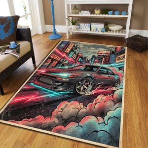 May include: A rectangular area rug featuring a graphic illustration of a dark sports car drifting on a city street. The design includes vibrant neon red and blue light streaks, stylized clouds of smoke, and Japanese text on building signs.