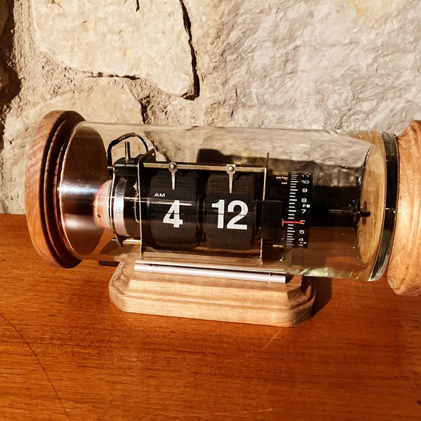 Vintage digital flip clock in glass case