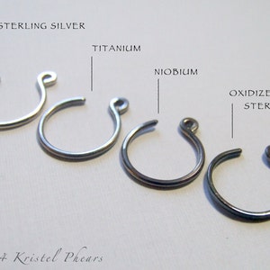 May include: Five hoop earrings in different metal finishes: sterling silver, titanium, niobium, oxidized sterling silver.  &copy; 2014 Kristel Phears