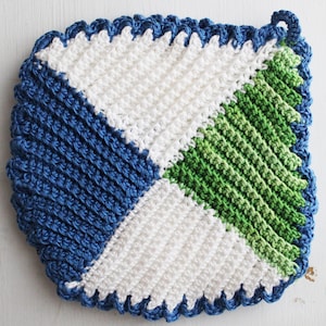 May include: A crocheted pot holder with a blue, white and green diamond pattern. The pot holder has a scalloped edge.