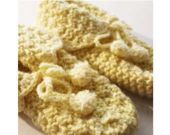 soft yellow hand knit bed slippers with pom pom ties