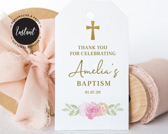 Può includere: Etichetta bianca con croce dorata e testo "THANK YOU FOR CELEBRATING Amelia's BAPTISM 01.07.20". Presenta un design floreale in basso. Include il testo "PERSONALISE & PRINT" e "Instant".