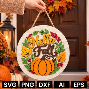 May include: A round wooden door sign featuring the text Hello Fall in yellow and brown script. The design includes a large orange pumpkin at the bottom, surrounded by green leaves, yellow maple leaves, and red berries on a light wood background.